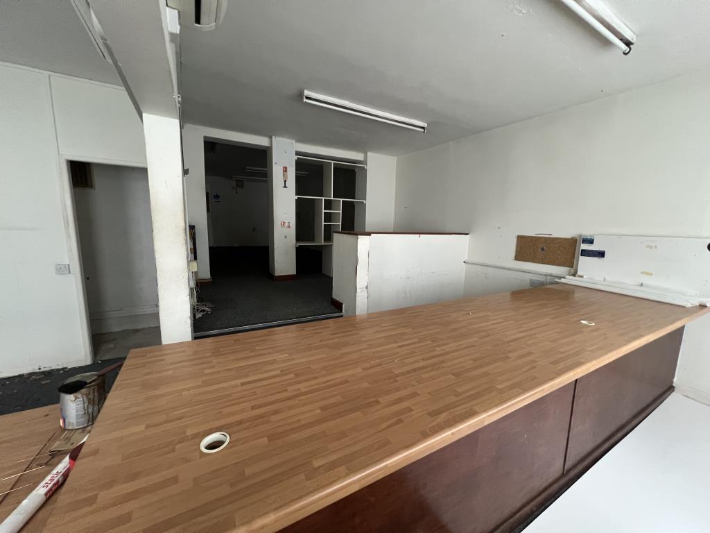 Lot: 128 - MIXED-USE DEVELOPMENT OPPORTUNITY WITH THREE GARAGES AND SIX PARKING SPACES - General view of Ground floor further office area